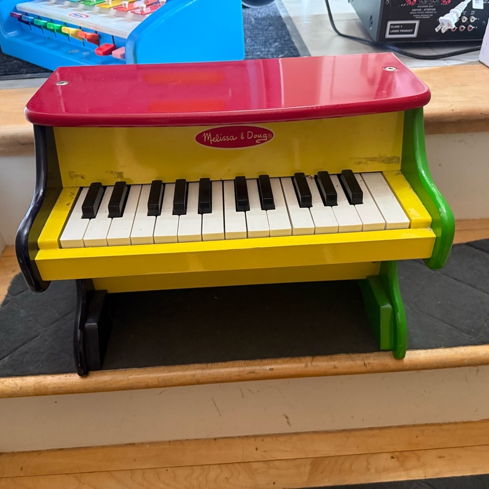 Melissa & Doug Wooden Toy Piano in Red, Yellow, Green, Black